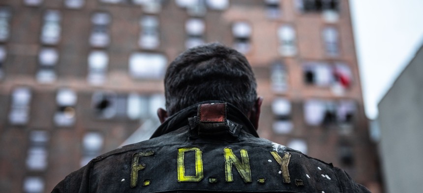 An FDNY firefighter at the scene of the Bronx fire.