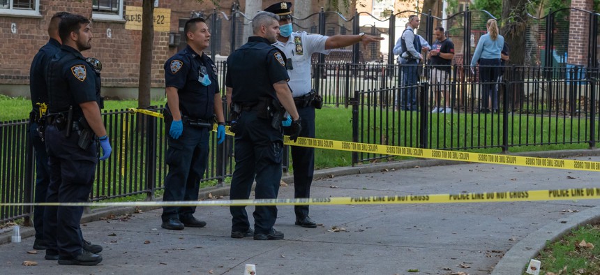 NYPD officers at a crime scene in Astoria.