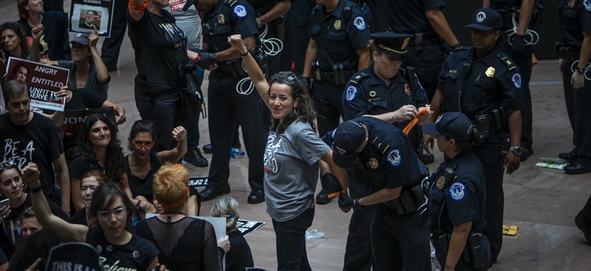 Ana María Archila arrested at a protest in Washington D.C.
