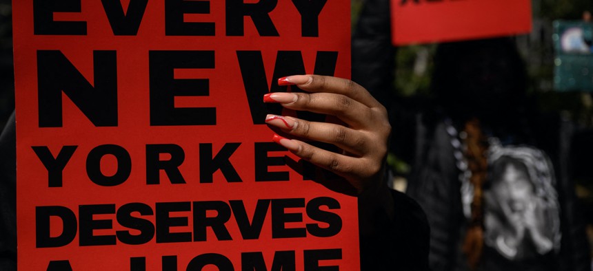 Protestors at City Hall on March 18 calling for better conditions at homeless shelters in NYC. 