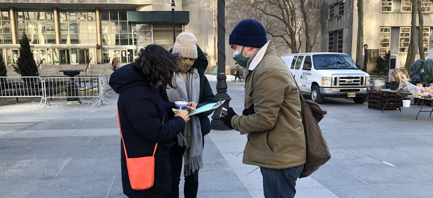 Now-New York City Council Member Lincoln Restler gathering signatures in 2021. 
