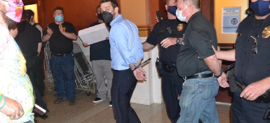Michael Pollack is arrested at the state Capitol