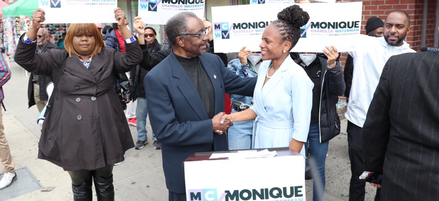 Former Assembly Member N. Nick Perry, center, and Monique Chandler-Waterman, right