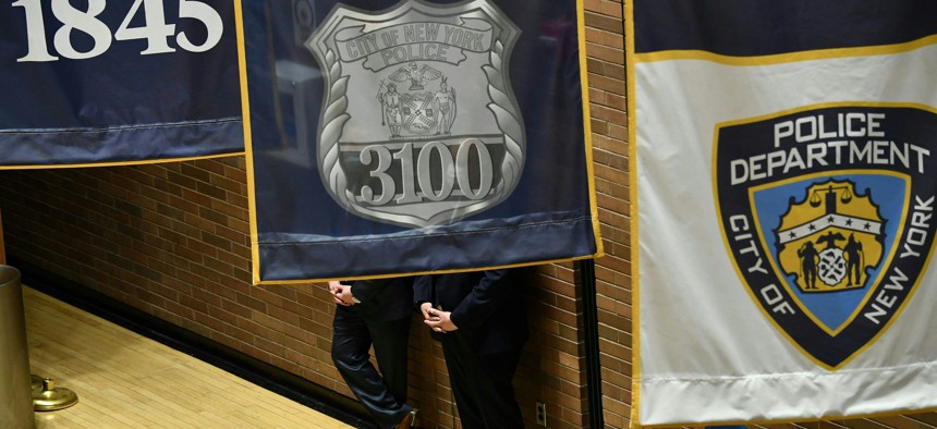 Banners hanging from the ceiling at the NYPD headquarters.