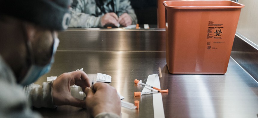 A man utilizes the narcotic consumption booths at a safe injection site at OnPoint NYC.