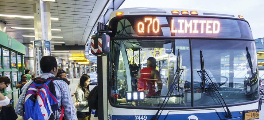 People boarding the Q70 bus at LaGuardia.