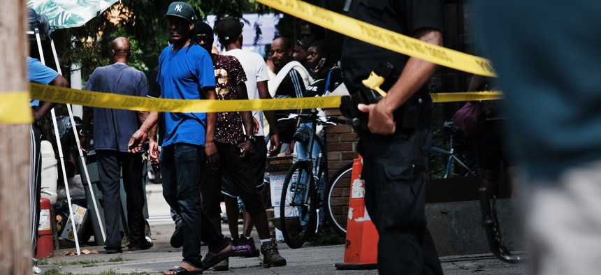 Police converge on the scene of a shooting in Brooklyn, one of numerous during the day, on July 14, 2021 in New York City. 
