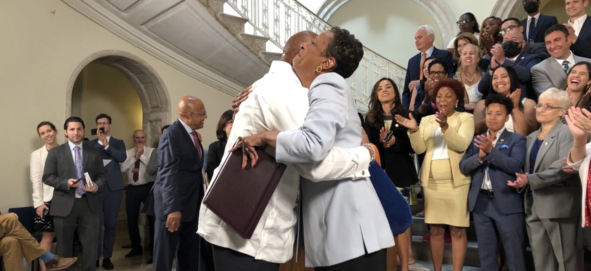 Mayor Eric Adams and City Council Speaker Adrienne Adams embrace after reaching a budget deal on June 10.