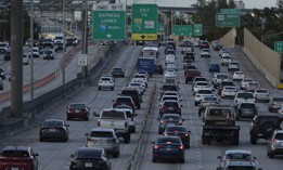 Vehicles are driven along I-95 on January 10, 2022 in Miami, Florida. 