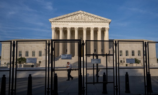 A police officer patrols the U.S. Supreme Court Building on June 21, 2022 in Washington, DC.