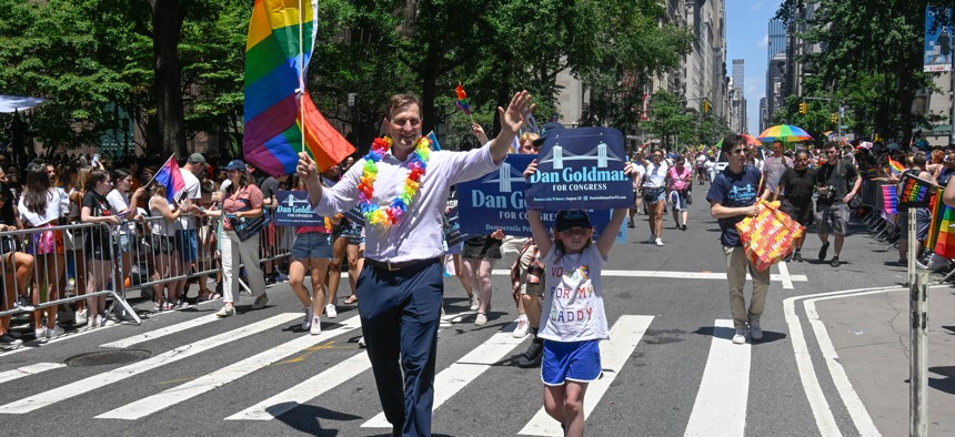 Congressional candidate Dan Goldman marches with his daughter in the 2022 New York City Pride march