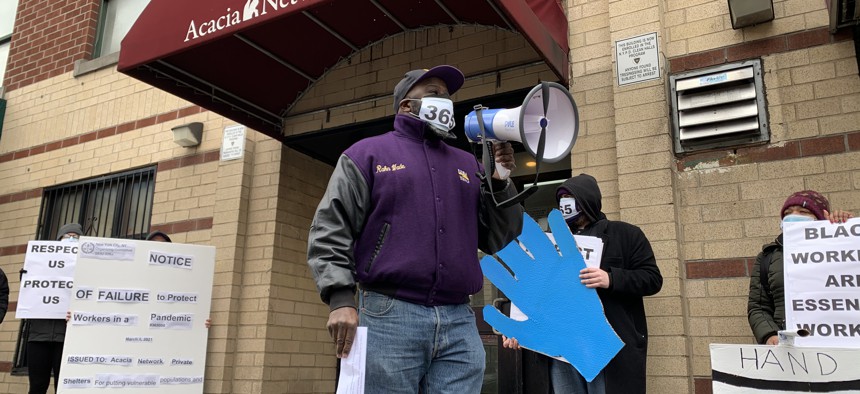 Security workers rally outside of Acacia Network’s headquarters.