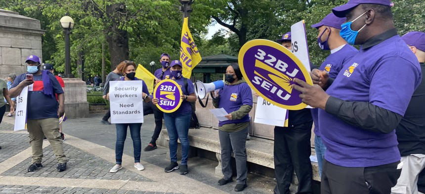 Security officers and New York City Council members gathered in Columbus Circle to call for better pay and training. 
