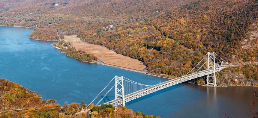 An aerial view of the Hudson River with a bridge crossing it