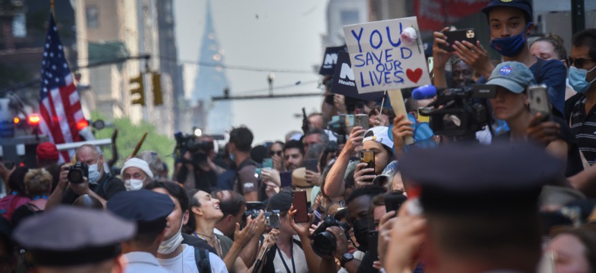 People celebrating at New York City's "Hometown Heroes" ticker tape parade.