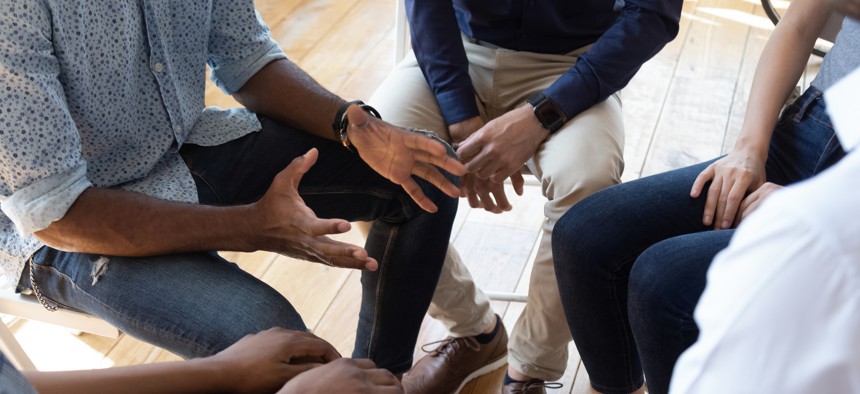 People sitting around in a circle.