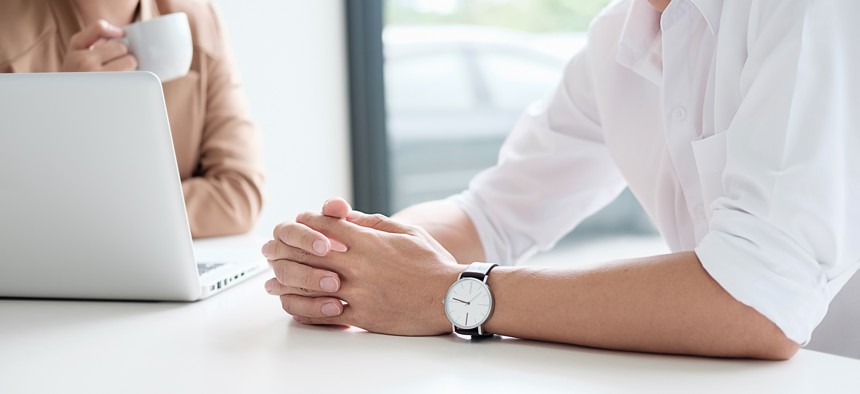 Woman talking to man.