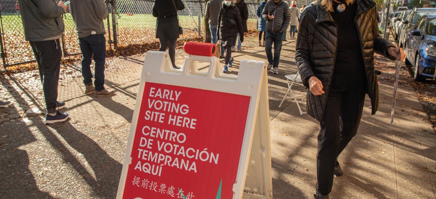 Voters wait in line to vote early in New York City during 2020 general election. 