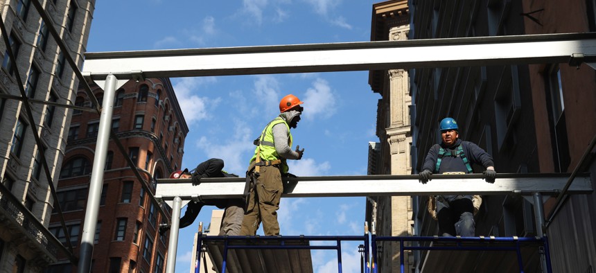 Construction workers in action in Lower Manhattan.