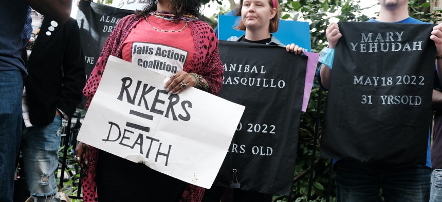 Demonstrators at City Hall protesting the living conditions at Rikers Island on June 23.