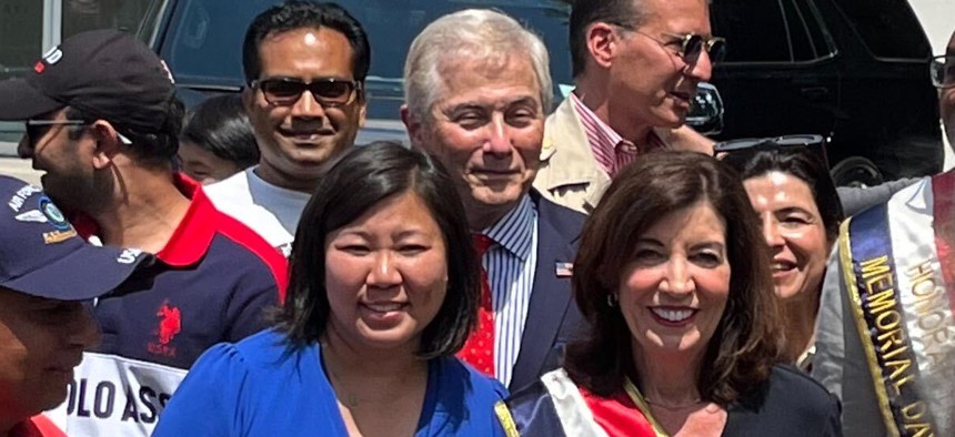 Robert Zimmerman, center, with Rep. Grace Meng and Gov. Kathy Hochul in the front row