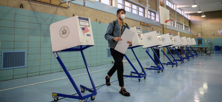 A voter casts his ballot at a voting center in Brooklyn, New York.