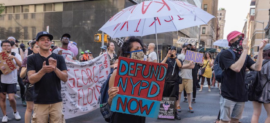 Demonstrators call for cuts in funding for the New York City Police Department during a protest in Manhattan, June 5, 2021.