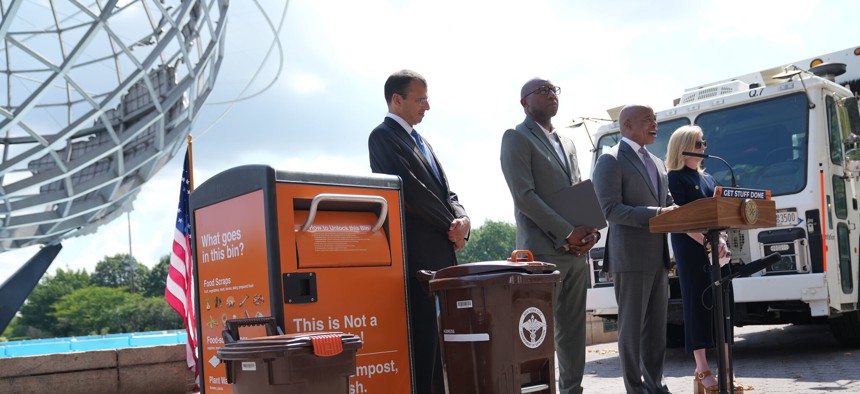 Mayor Eric Adams, at the podium, and Sanitation Commissioner Jessica Tisch unveiled a new Queens composting program.