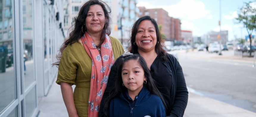 P.S. 110Q Parent Coordinator Miriam Sosa (left) with Ernestina Ramos, mother of four children including P.S. 110Q kindergarten student Maya Muñoz. Flushing Bank’s $15,000 Community Scholarship puts an additional $107.91 into each of the NYC Scholarship Accounts of 139 kindergarten students at P.S. 110Q to support their college and career dreams.