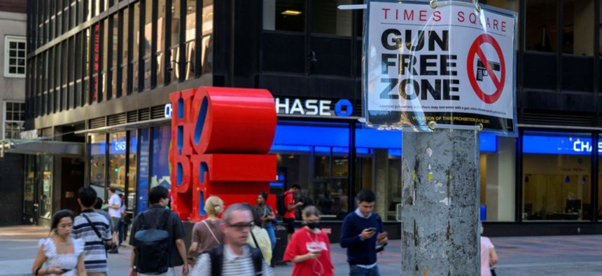 A "Gun Free Zone" sign is seen posted near Times Square in Manhattan on September 1, 2022 in New York.