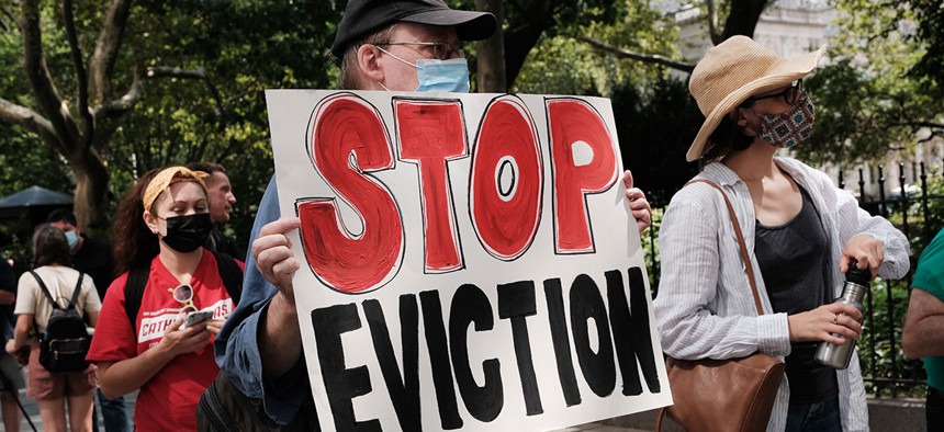 Pictured are activists against evictions protesting near City Hall.