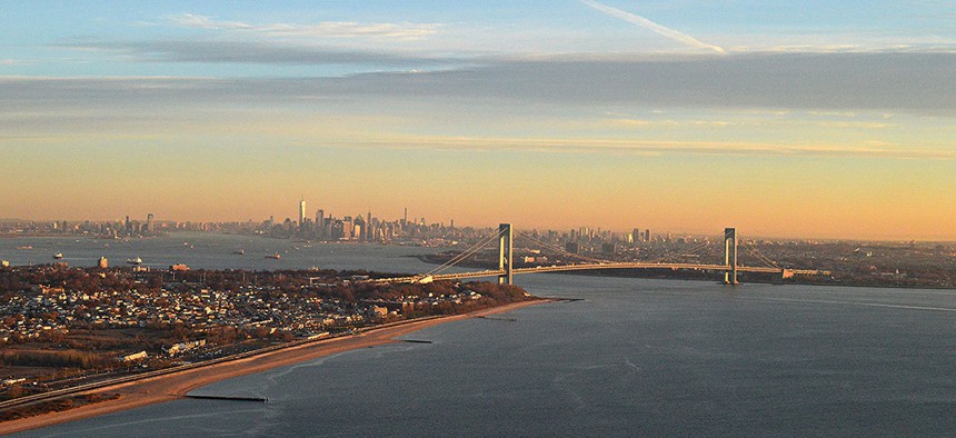 An aerial view of Staten Island and the Verrazzano Bridge at sunrise.