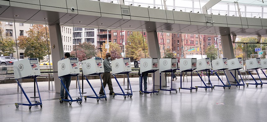 Voters cast their ballots at a polling station during early voting at the Brooklyn Museum last week.
