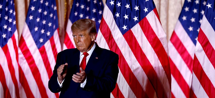 Former US President Donald Trump applauds while speaking at the Mar-a-Lago Club in Palm Beach, Florida on November 15, 2022.