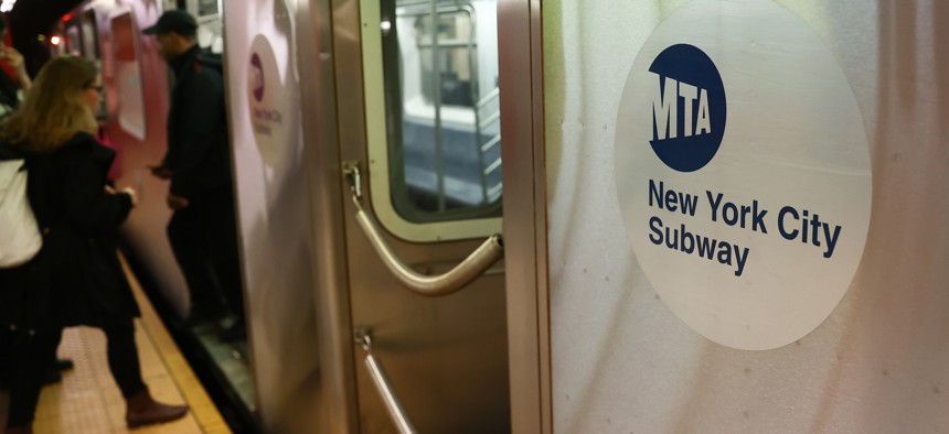 Passengers boarding a New York City subway train in October. 