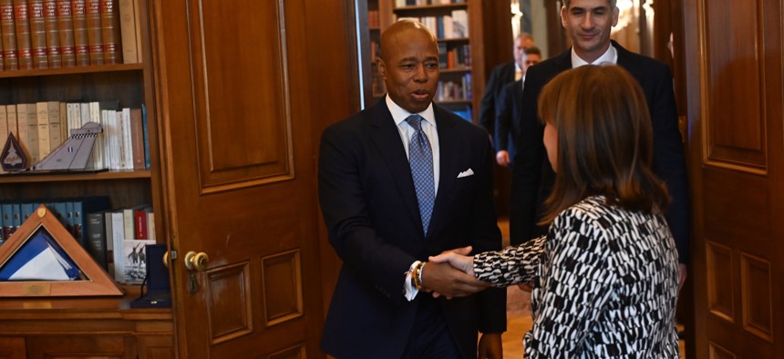 New York City Mayor Eric Adams shakes the hand of  President of the Hellenic Republic Katerina Sakellaropoulou while he’s followed by Athens Mayor Kostas Bakoyannis for a meeting in Athens Thursday. 