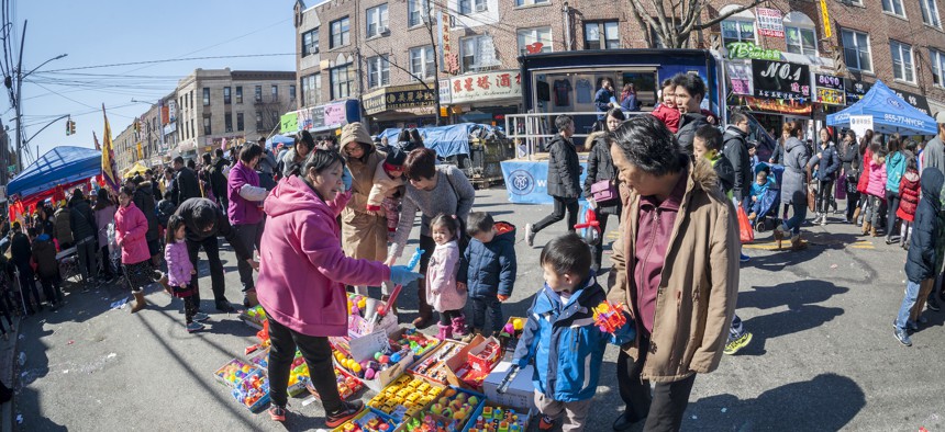 Thousands of people at a Lantern Festival street fair on Eighth Avenue in Sunset Park, Brooklyn. Parts of the strip are now part of the new City Council District 43, which was redrawn during redistricting last year to create a new Asian American majority in the borough.