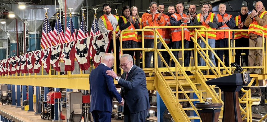 Senate Majority Leader Chuck Schumer warmly greets President Joe Biden at an event Tuesday touting a nearly $300 million grant advancing the long-delayed Gateway Hudson River tunnel project.