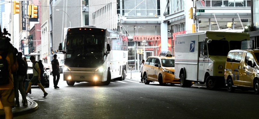 A bus carrying asylum seekers arrives in New York City from Texas on Aug. 7, 2022.