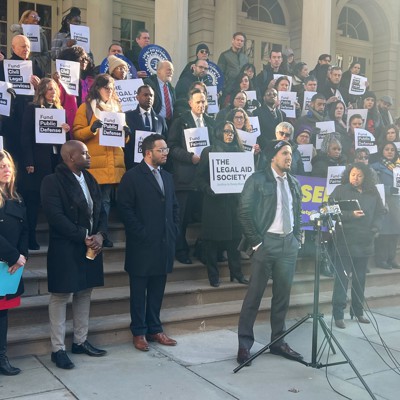 Public defenders and legal service providers rallied for increased city funding