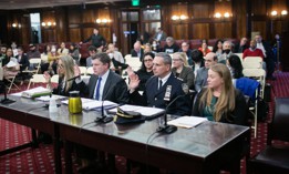 NYPD Director of Legislative Affairs Michael Clarke (second from left) testifies at a City Council hearing on March 27, 2023. 