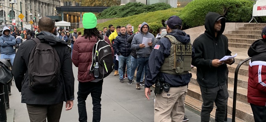 People stand on line waiting to get into immigration court inside 26 Federal Plaza in Lower Manhattan last November.