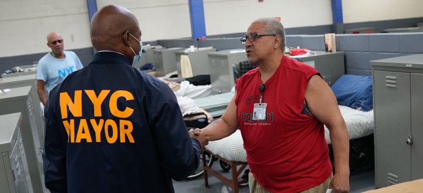 Mayor Eric Adams visits a shelter for homeless Veterans - without dividers between beds - in Queens on November 9, 2022.