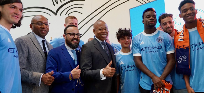 New York City Council Member Francisco Moya, in blue suit jacket, wants to bring New York City FC to Queens.
