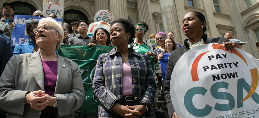 City Council members attend a rally against budget cuts to education on May 22, 2023