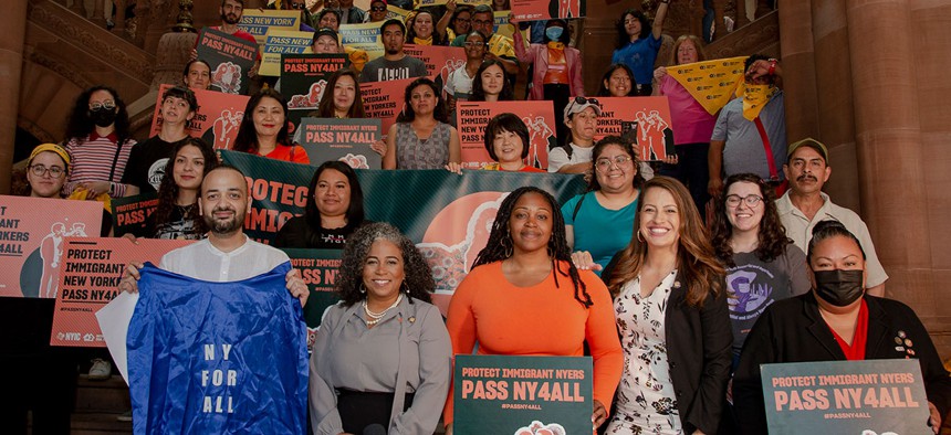 Front row from left: New York Immigration Coalition Executive Director Murad Awawdeh, Assembly Member Karines Reyes, Assembly Member Chantel Jackson, Assembly Member Catalina Cruz and Assembly Member Marcela Mitaynes.