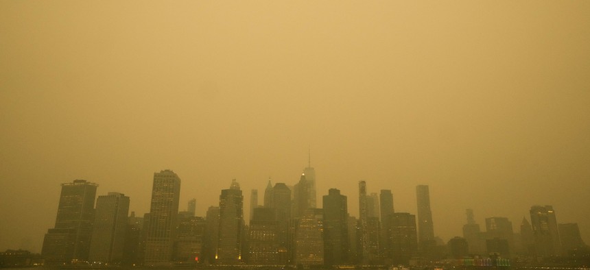 New York City was blanketed in a yellow fog that rubs its back upon the window panes.