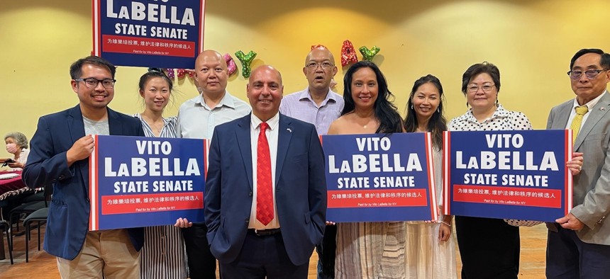 Ying Tan, in the striped dress second from the left, campaigning for Vito LaBella, center, last year.