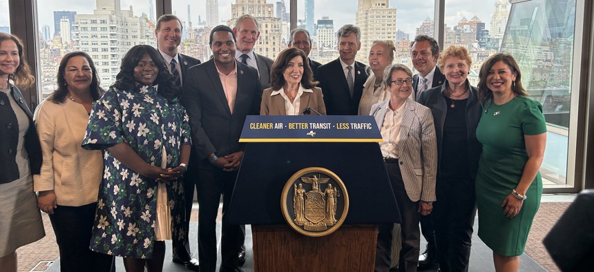 Gov. Kathy Hochul, center, was joined by (starting from left) Sarah Kaufman, interim executive director of the NYU Rudin Center for Transportation, state Department of Transportation Commissioner Marie Therese Dominguez, Riders Alliance organizer Danna Dennis, Reps. Dan Goldman and Ritchie Torres, MTA Chair Janno Lieber, Comptroller Brad Lander, state Sen. Brad Hoylman-Sigal, City Council Member Gale Brewer, Assembly Members Deborah Glick, Tony Simone, Jo Anne Simon and Jessica Gonzáles-Rojas.
