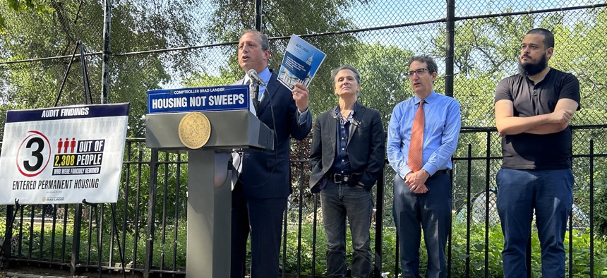 New York City Comptroller Brad Lander speaking at a press conference in Tompkins Square Park